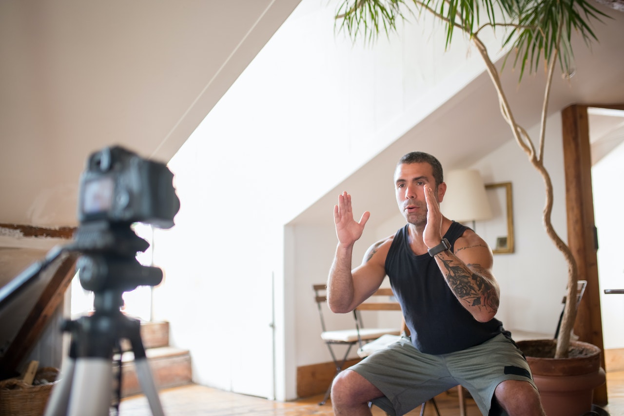 Tattooed man vlogging